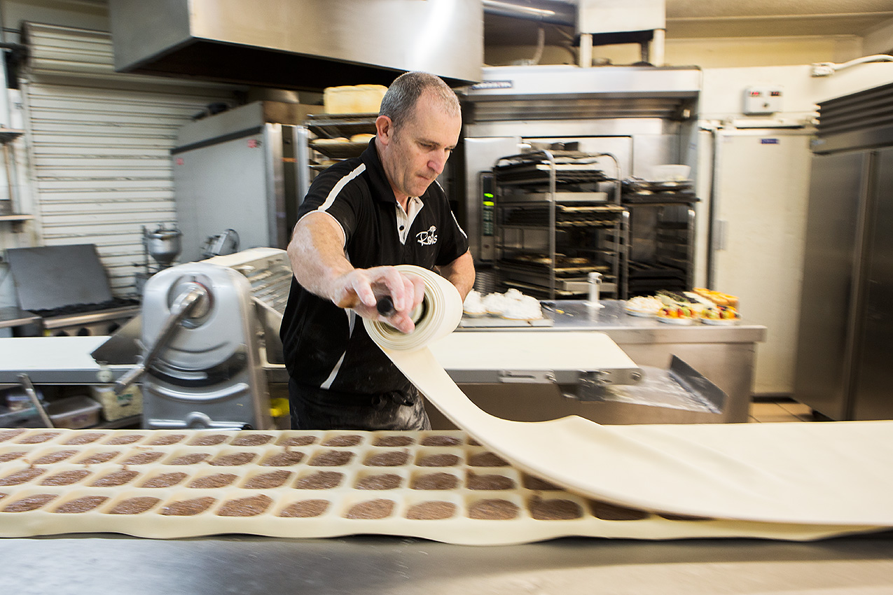 A baker preparing food at our bakery in the Geelong area